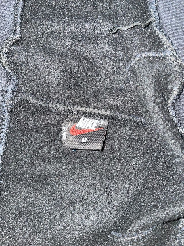 Tuta Nike nera con stampa floreale