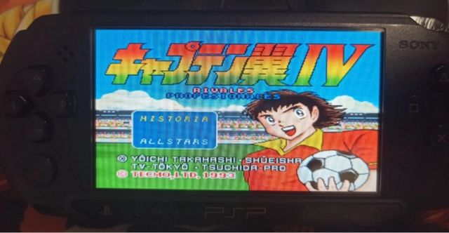 PSP nera con caricabatterie e SD