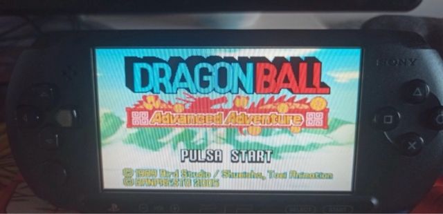 PSP nera con caricabatterie e SD