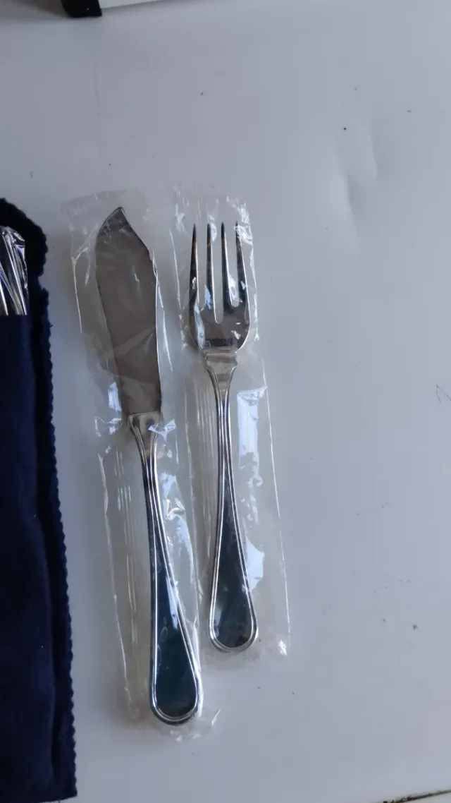 4 conf. Posate in argento.