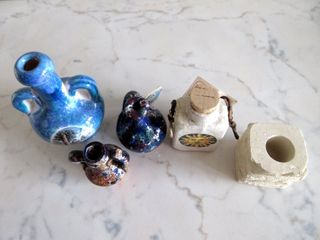 Souvenir. Anfore in ceramica e portacandela pietra