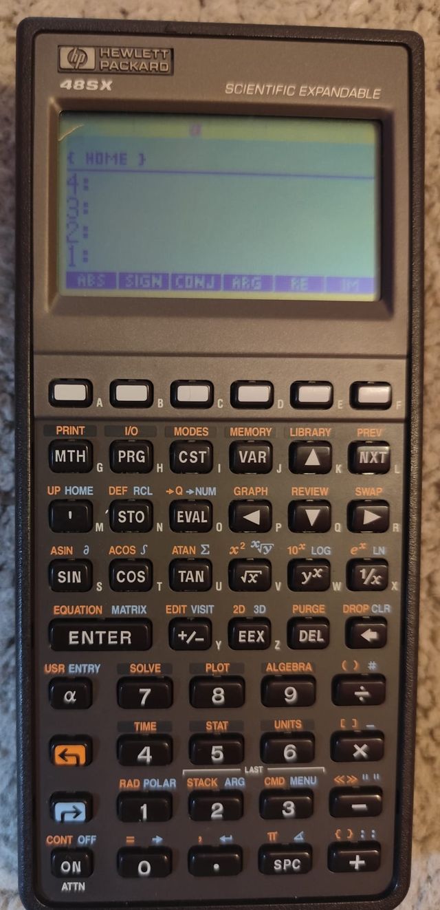Calculadora HP 48SX con funda y manual