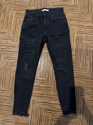 Jeans neri strappati