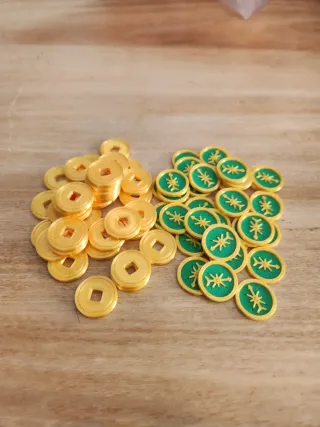 Monedas y Fichas Arnak (Brujulas) 36 de cada tipo.