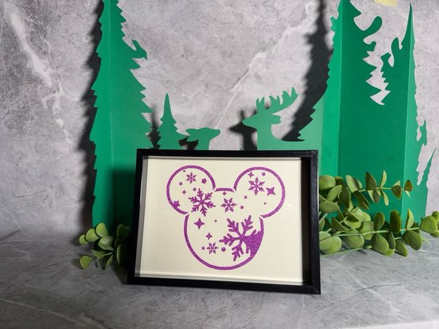 Marco Mickey Mouse con copos de nieve