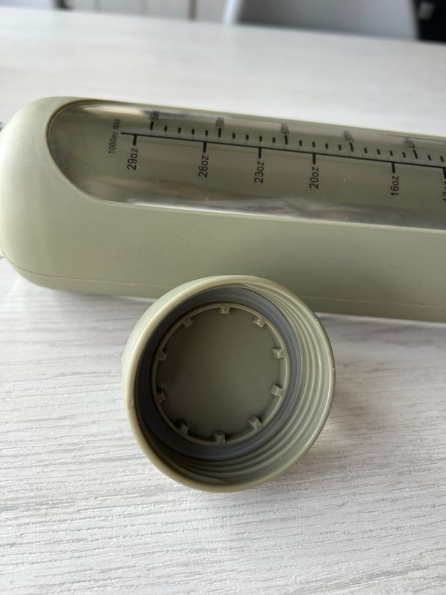 Botella de vidrio con funda de silicona