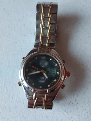 Orologio HMO oro e argento anni 80 







