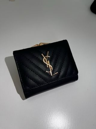 Portafoglio Saint Laurent nero con logo oro