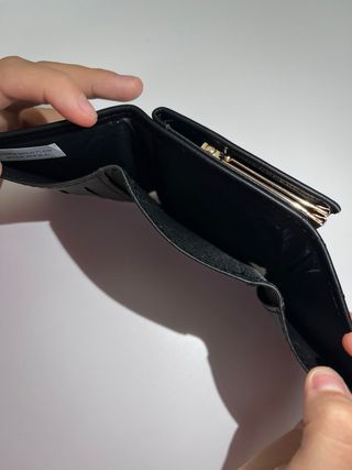 Portafoglio Saint Laurent nero con logo oro