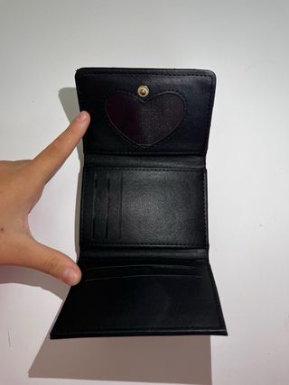 Portafoglio Saint Laurent nero con logo oro