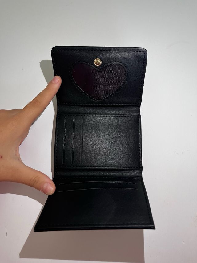Portafoglio Saint Laurent nero con logo oro