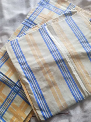 Lenzuola lettino a righe e quadri