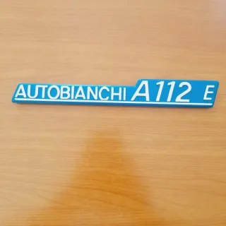 Scritta "AUTOBIANCHI A112E" 1971/74.Plastica Nuova