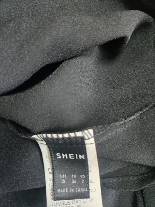 Blusa negra encaje lazo espalda Talla XS