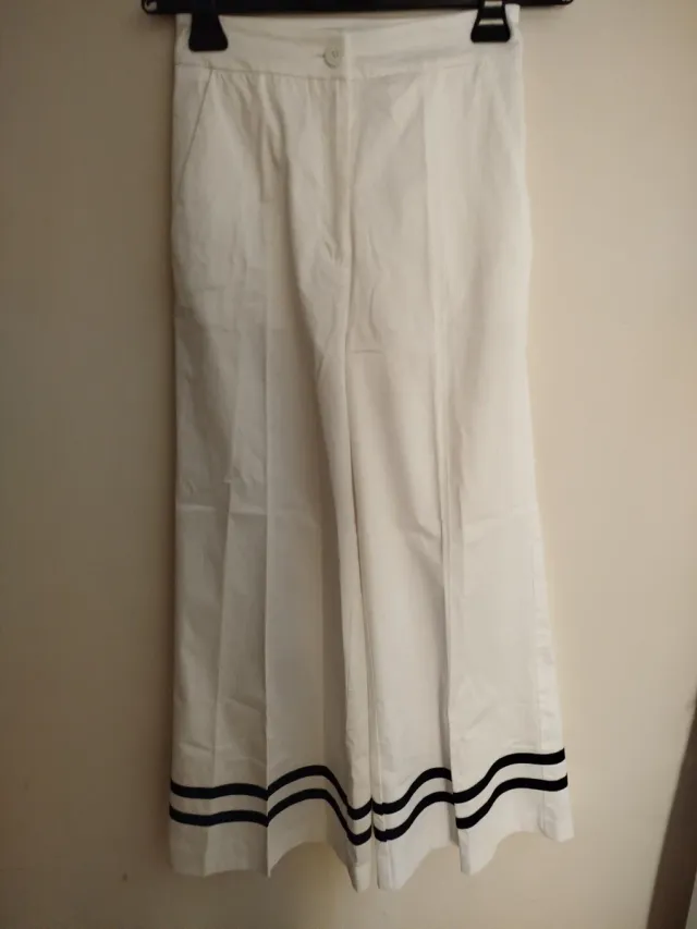 Pantaloni donna bianchi a zampa