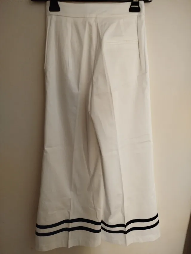Pantaloni donna bianchi a zampa