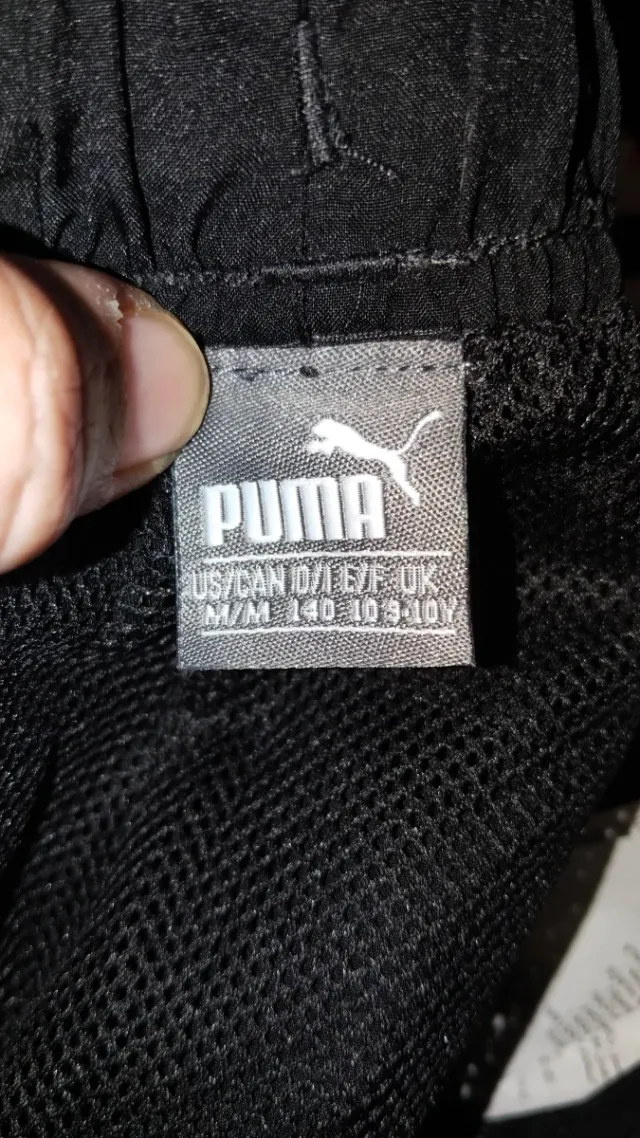 Conjunto deportivo Puma negro Talla 9'10 años