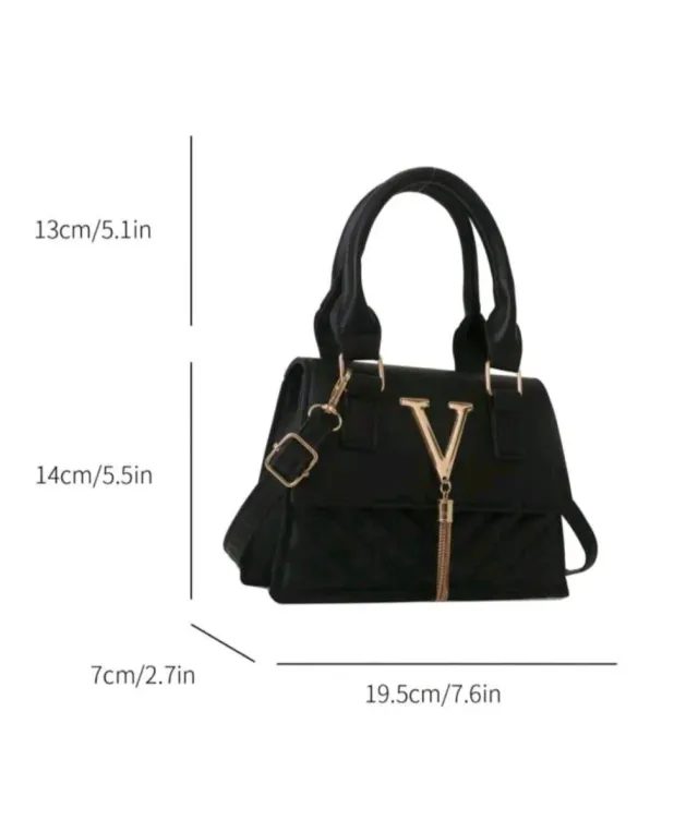 Bolso mini negro con detalles dorados
