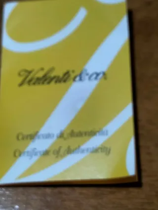 Scatolina in legno con inserto in argento.