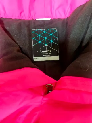 Pantalones y guantes de esquí rosas
