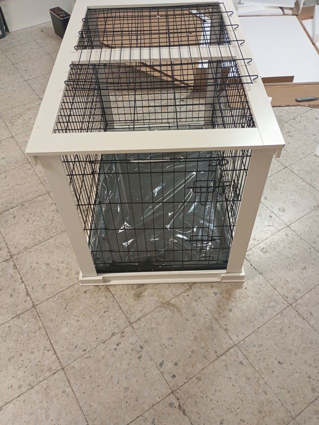 Jaula para mascotas negra y blanca