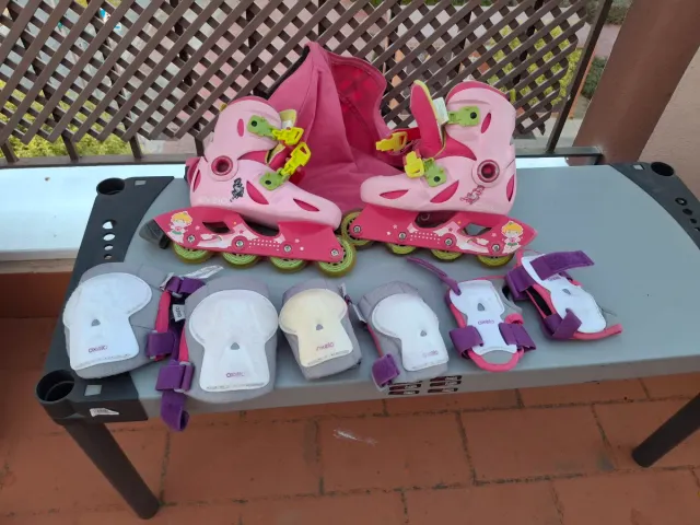 Pattini rosa per ragazze + protezioni + zaino