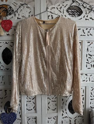 Cazadora dorada lentejuelas, puesta una ocasión