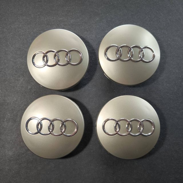 TAPABUJES AUDI 68mm GRIS - EMBLEMA LLANTAS AUDI