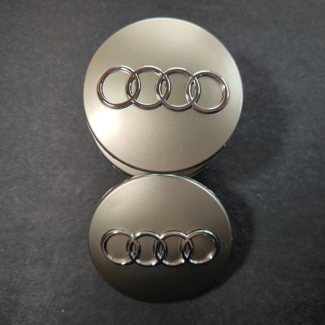 TAPABUJES AUDI 68mm GRIS - EMBLEMA LLANTAS AUDI