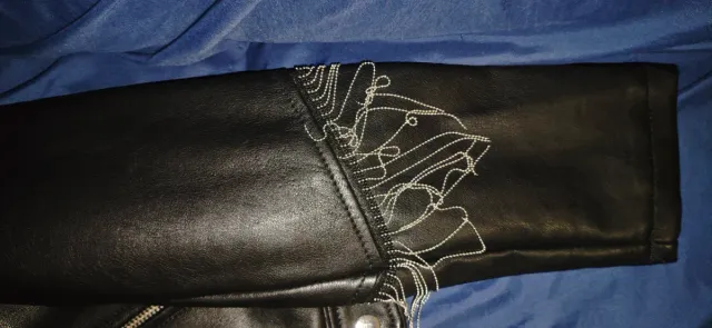 Chaqueta polipiel negra con flecos Talla M