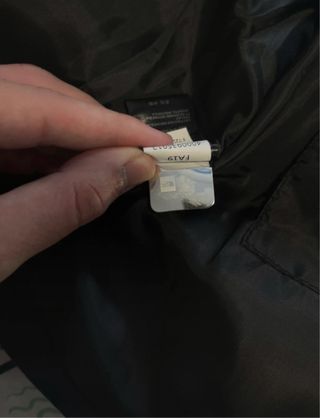 Cazadora The North Face Negra y Azul Marino