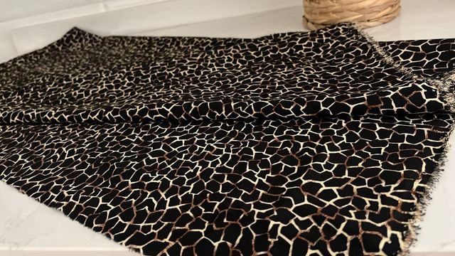 Tecido com estampa animal