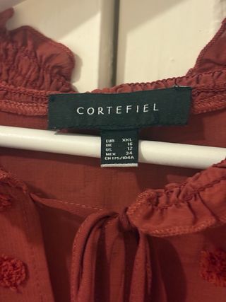 Blusa Cortefiel transparente color ladrillo.