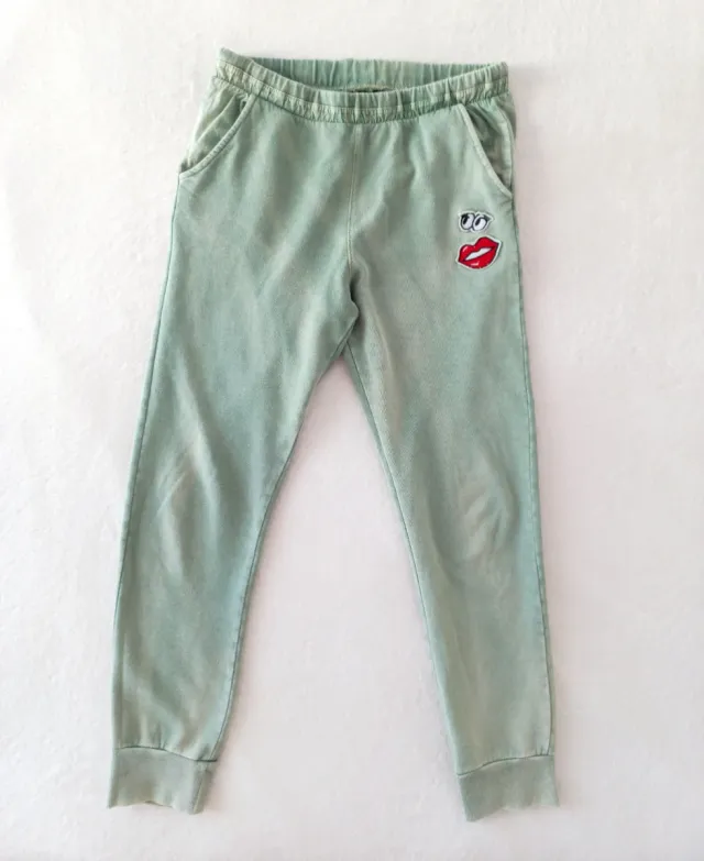 Nuovi pantaloni in cotone verde con design divertente