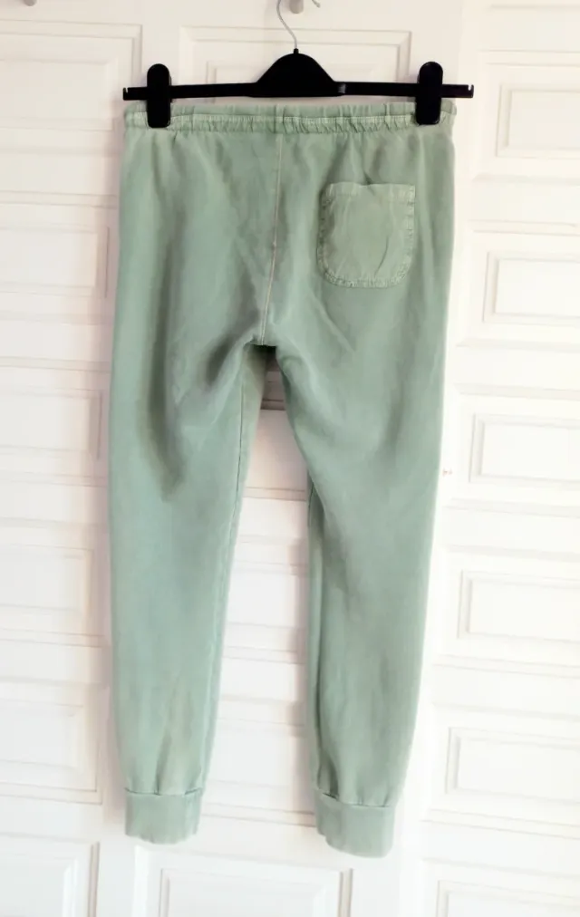 Nuovi pantaloni in cotone verde con design divertente