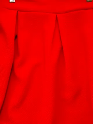 Minifalda naranja con tablas y vuelo. Talla M