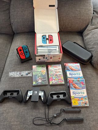 Nintendo Switch OLED + 3 Giochi e accessori