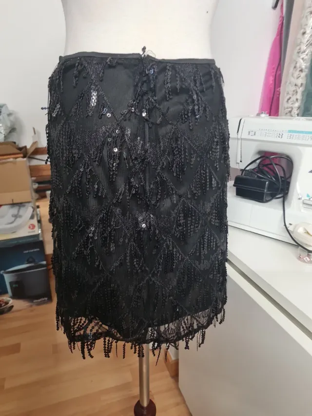 Falda negra lentejuelas flecos