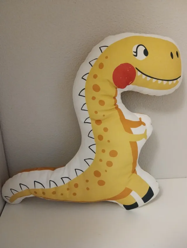 Cojín dinosaurio amarillo