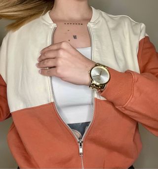 Chaqueta deportiva Zara beige y naranja