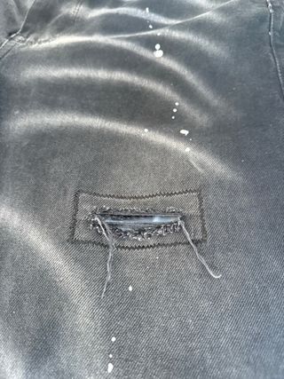 Pantalón vaquero AMIRI negro con manchas