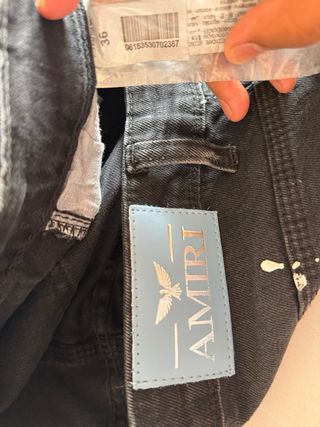 Pantalón vaquero AMIRI negro con manchas