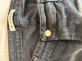 Pantalón vaquero AMIRI negro con manchas