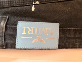 Pantalón vaquero AMIRI negro con manchas
