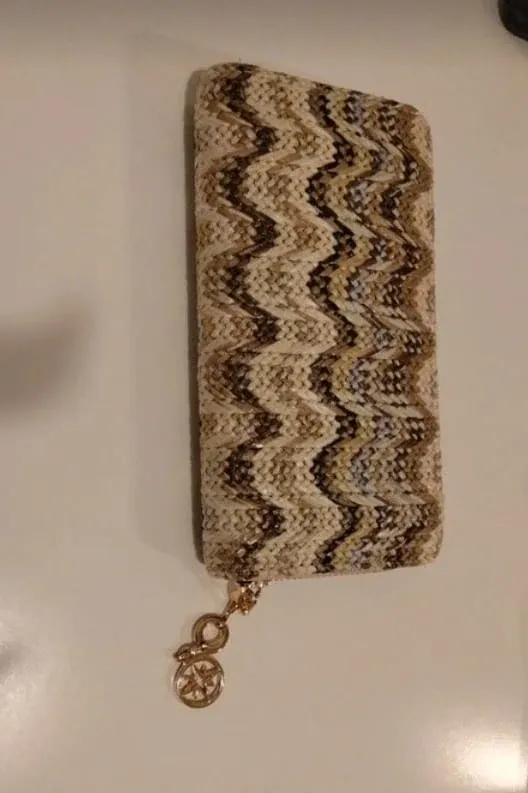 Portafoglio con ciondolo a forma di bussola