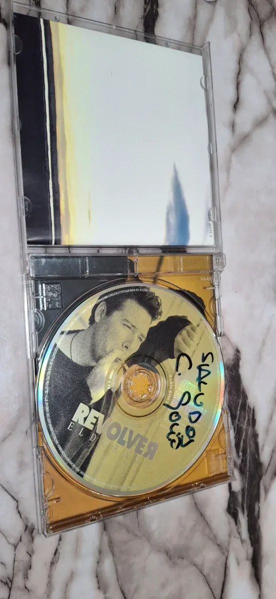 CD Revolver El Dorado Firmado