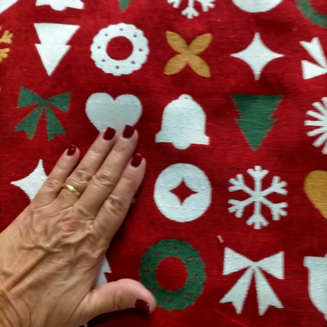 Tela de tapicería con motivos navideños.