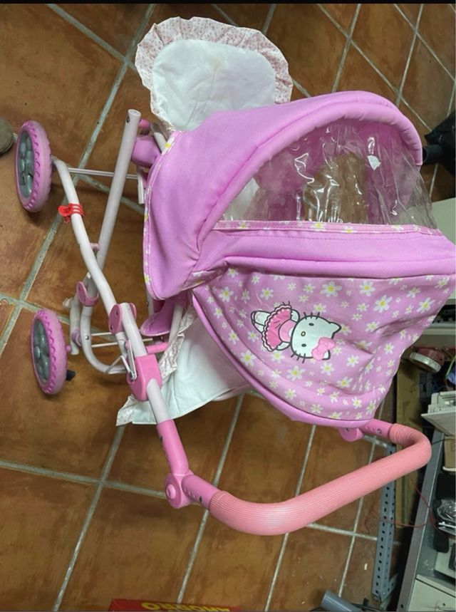 Carrito de muñecas rosa Hello Kitty