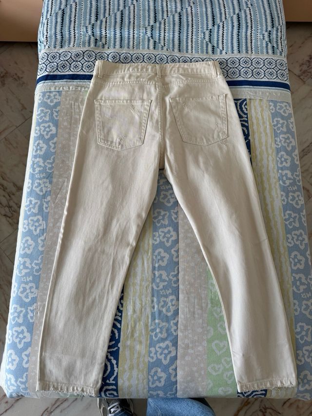 Jeans beige strappati