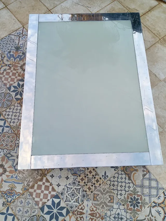 Mesa de centro de diseño en acero cromado años 80s